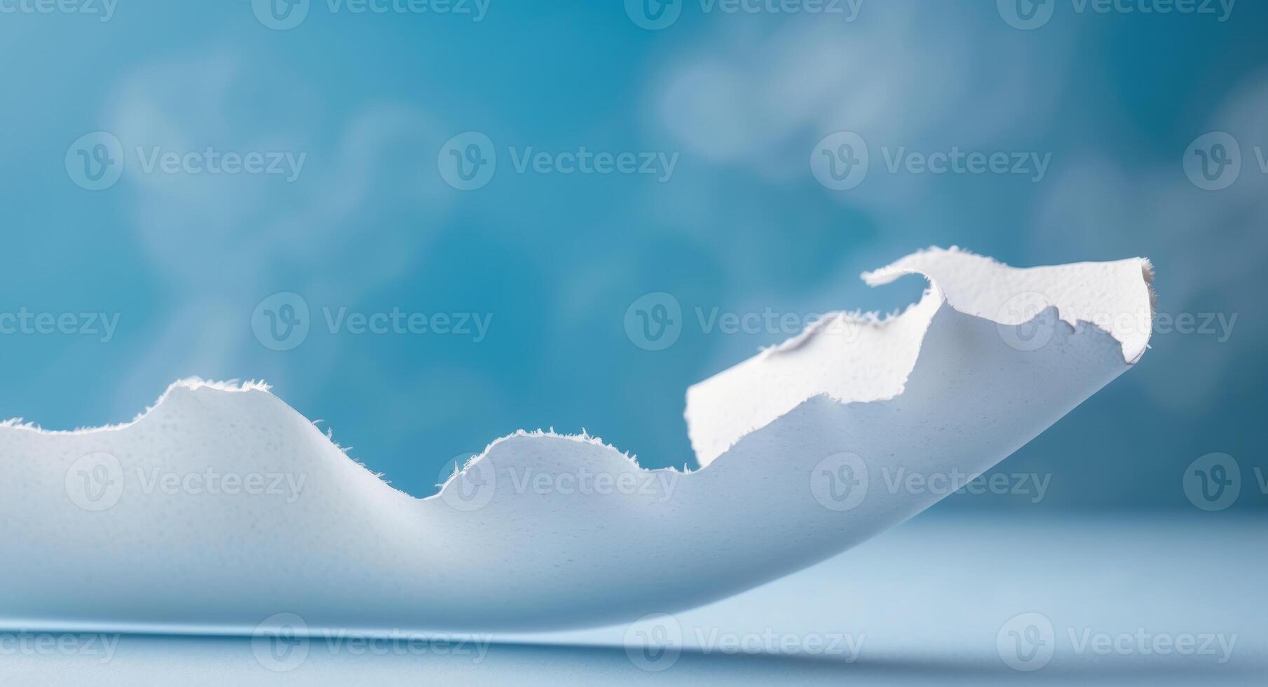 Torn White Paper Effect on Blue Background with Curved Edges photo