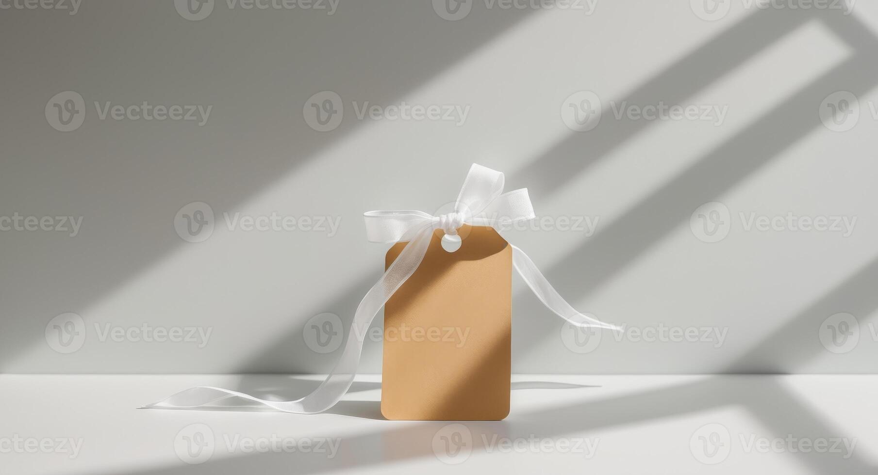 A gift tag with a white ribbon and a shadow photo