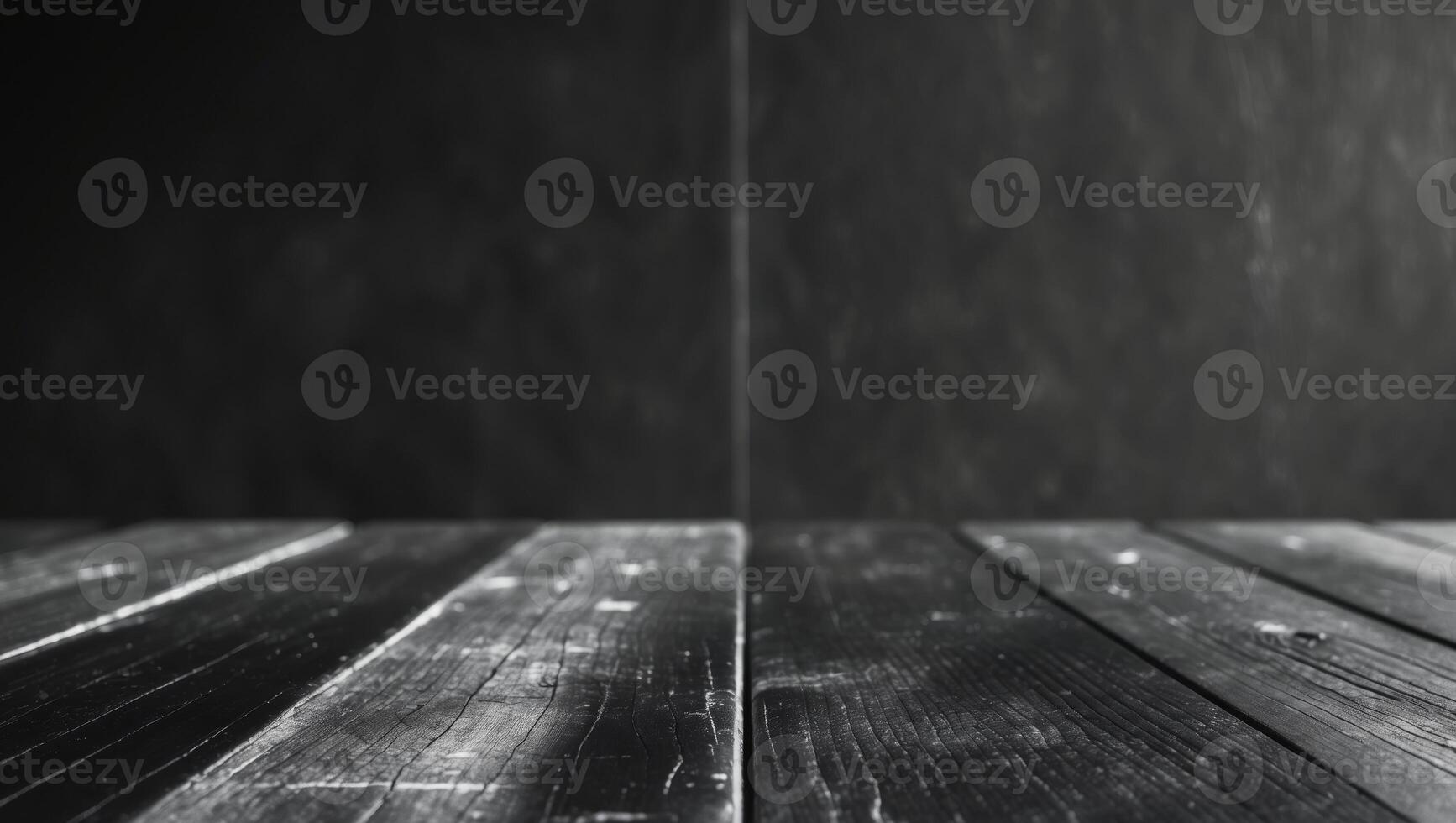 a close up of a wooden table with a black wall photo