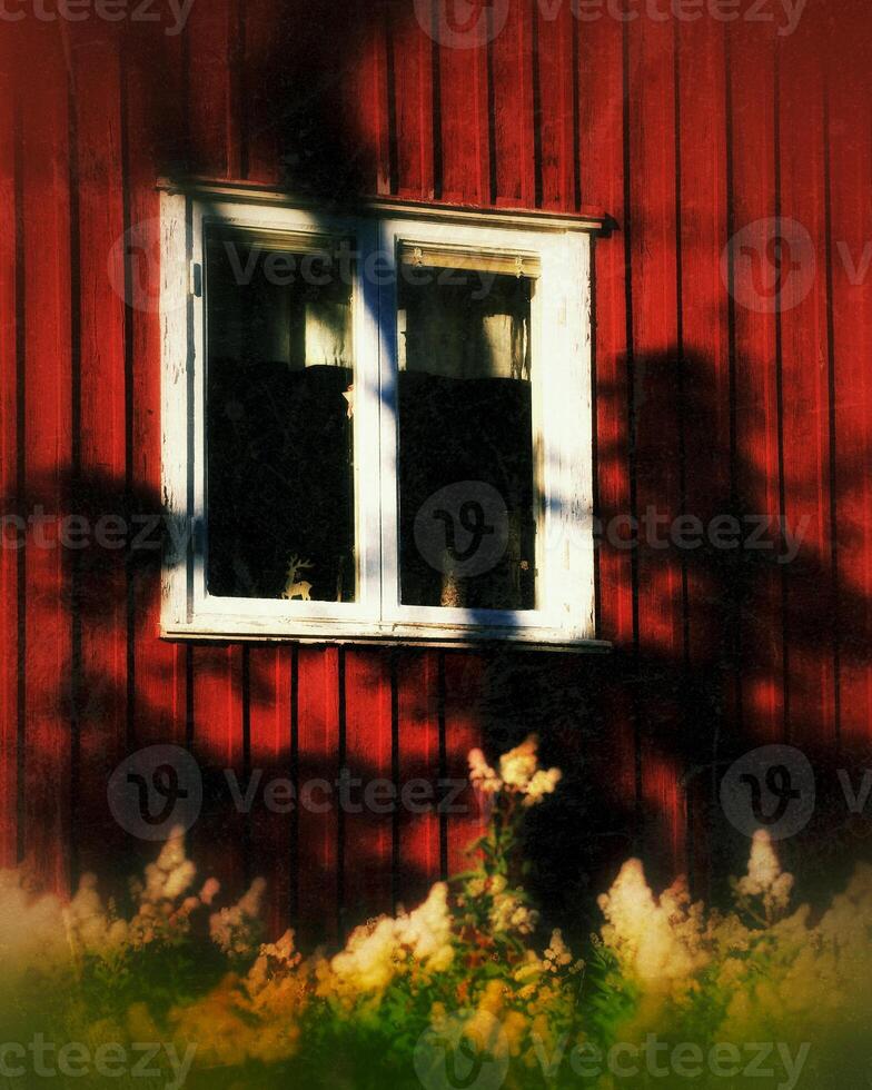 Grungy shot of a weathered window of northern Swedish farm house photo