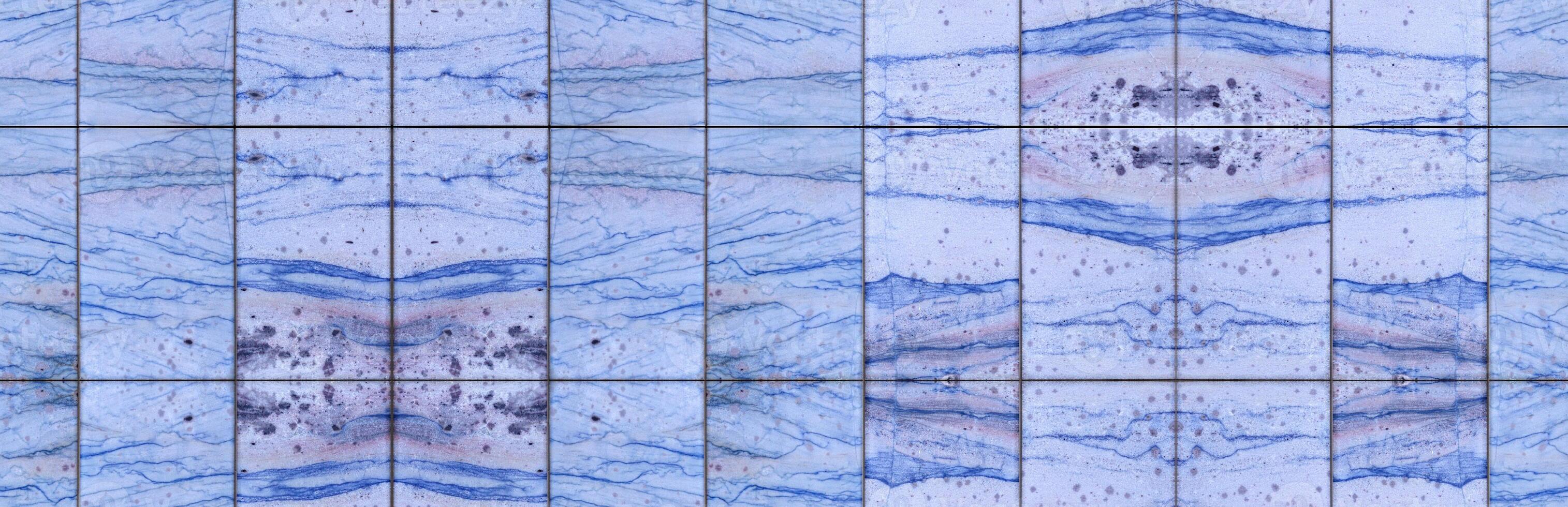 Seamlessly tileable texture of several blue marble tiles photo