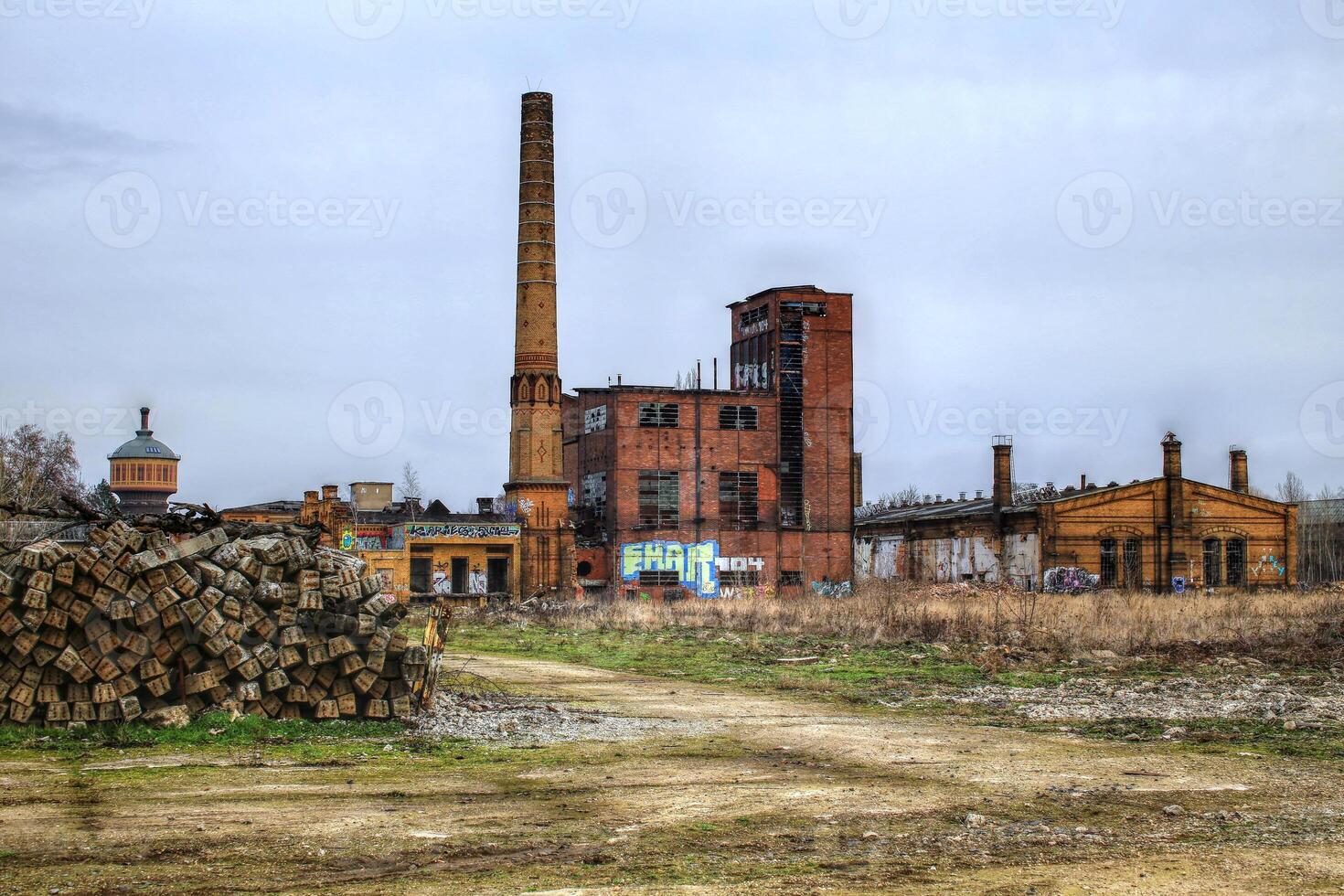 Power house of a huge former railway workshop in Germany, with big smokestack photo