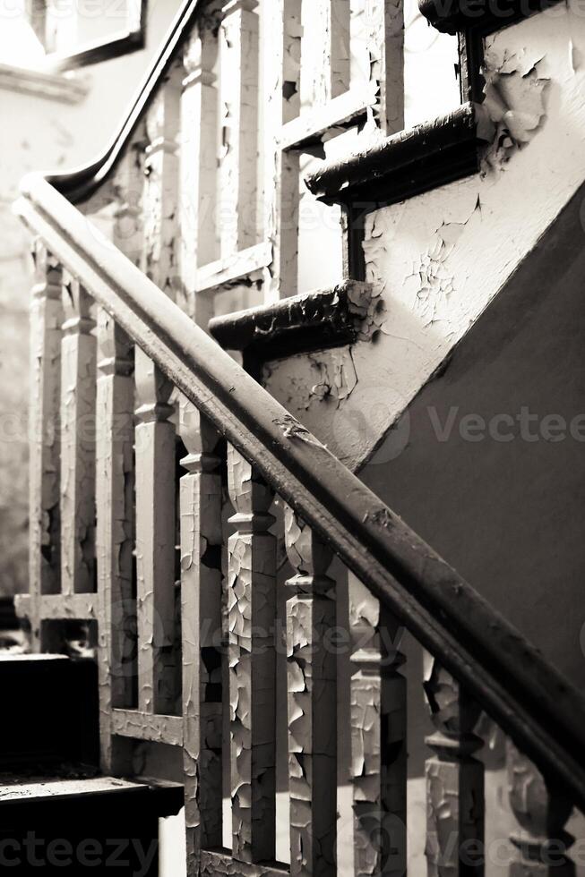 Black and white image of destroyed staircase railing photo