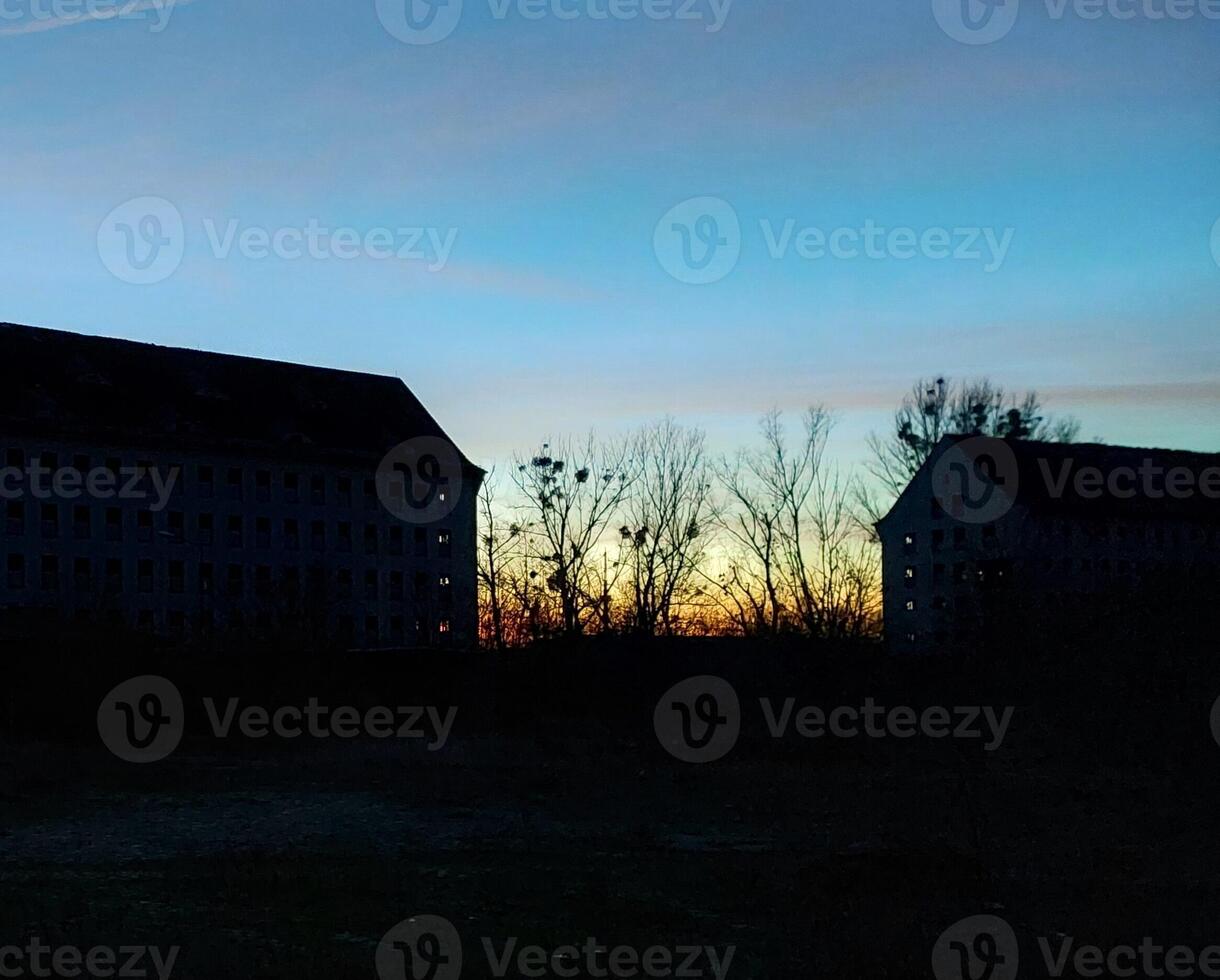 Abandoned storage buildings in east Germany in dusk photo