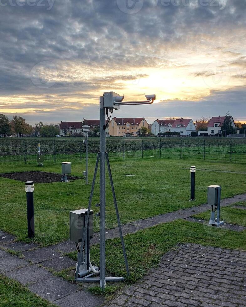Weather station in Germany with a modern laser disdrometer measuring precipitation photo