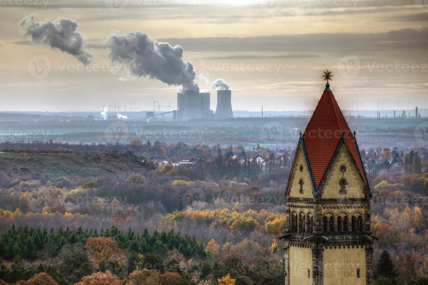 Chapel and crematory in the south cemetary of Leipzig, in the background an electrical power plant photo