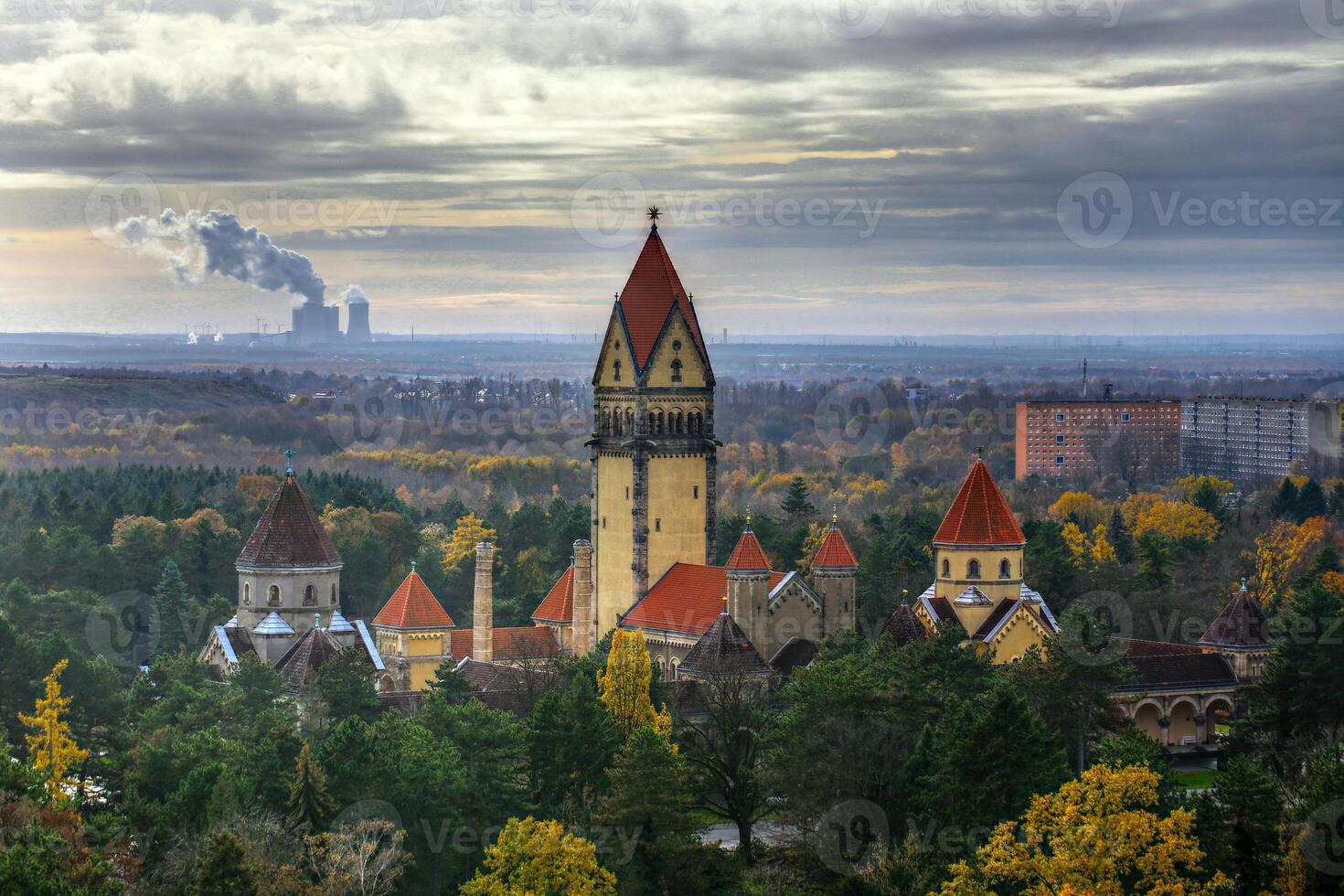 Chapel and crematory in the south cemetary of Leipzig, in the background an electrical power plant photo