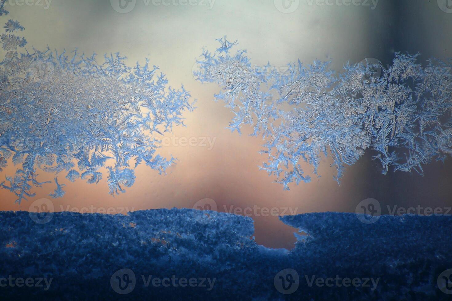 Close up of window frost and snow on a pane photo