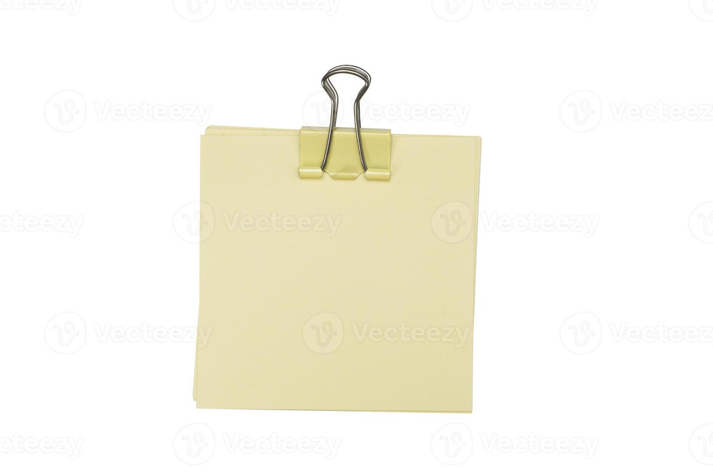Blank post it note with green paper clip isolated on white, yellow color post it paper with creases and curling photo