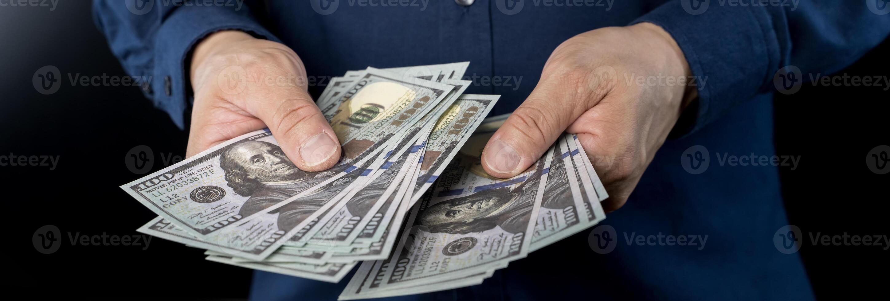 American Dollars Cash Money. 100 dollars banknotes in the background. photo