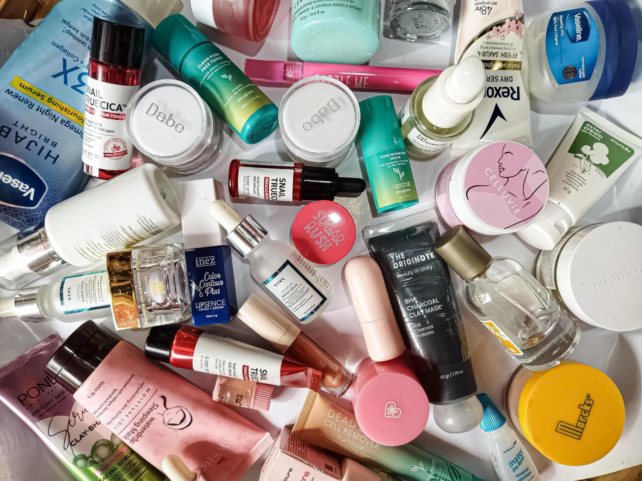 Surakarta, Indonesia - Desember 15, 2024. Many used bottles and jars for different brandy feminines. Containers for shampoo and lotions, cans for creams and face masks photo