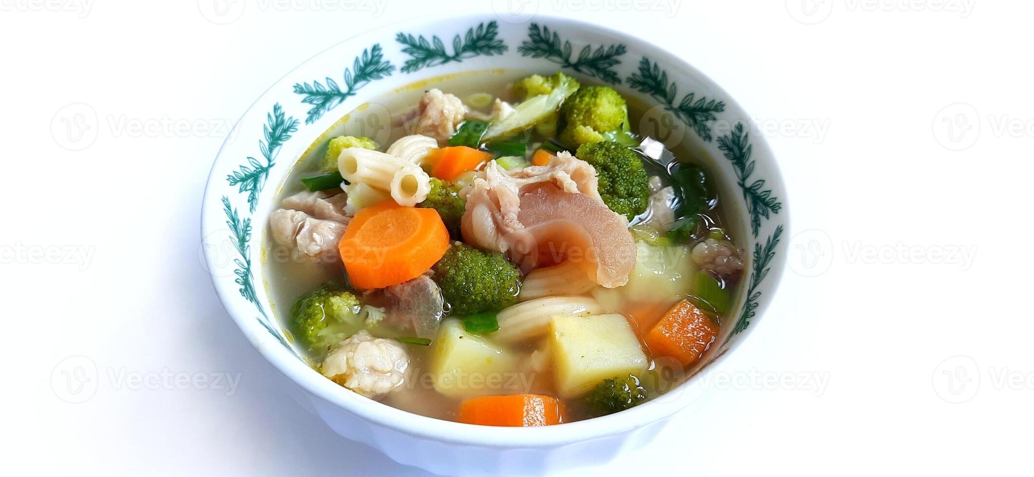 Sayur sop or vegetable with meat soup on the plate. Indonesian popular culinary. Healthy food and delicious photo