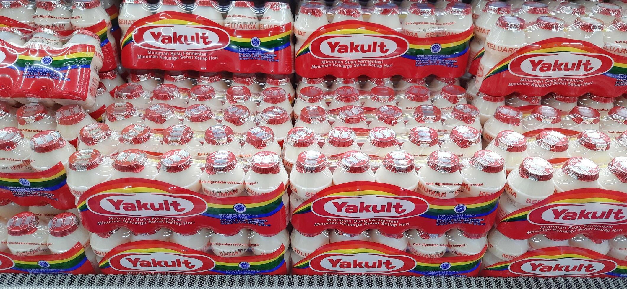 Fresh drink Yakult on display for sale at the naga swalayan supermarket. Jakarta, Indonesia - December 24 2024 photo