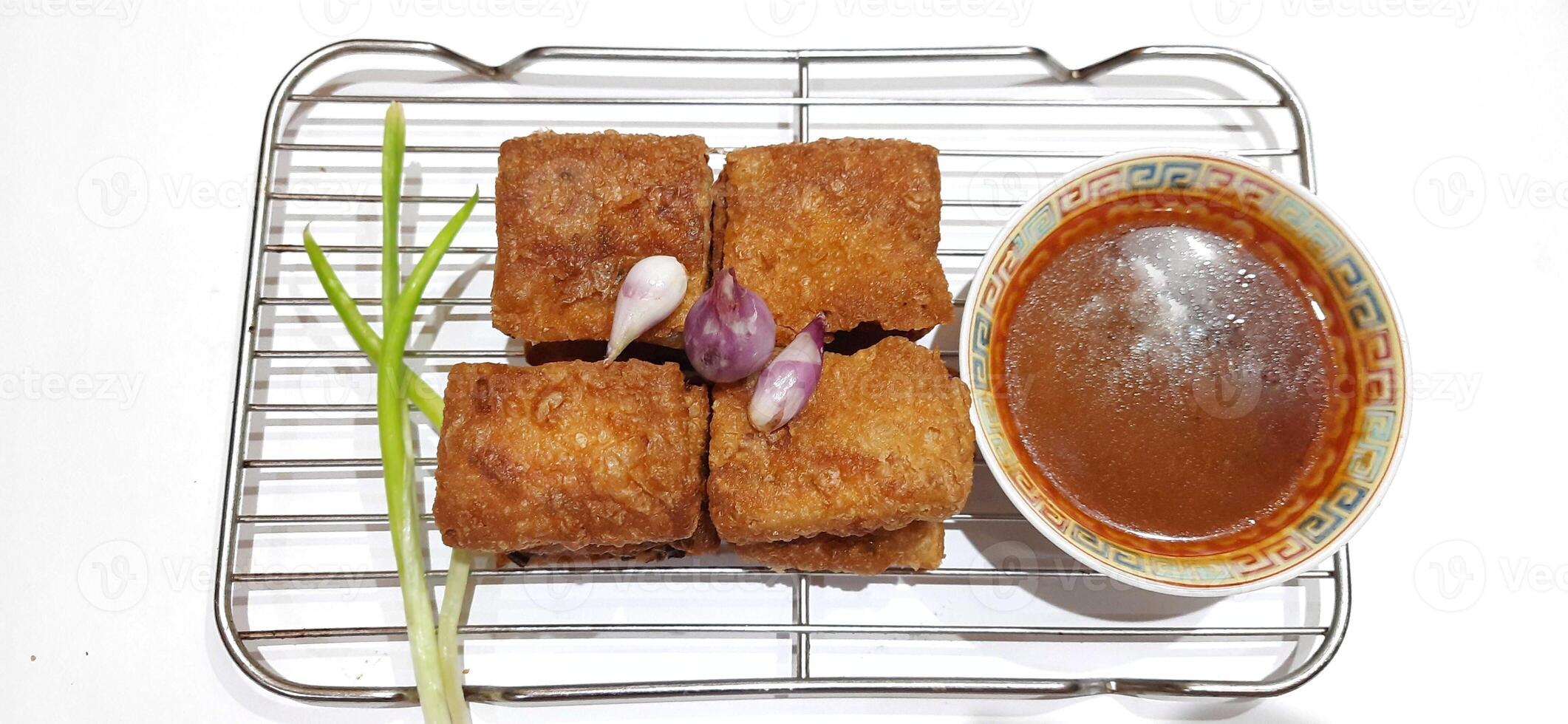 Martabak telur or Martabak telor. Savory pan fried pastry stuffed with egg, meat and spices served with sauce, Indonesian street food photo