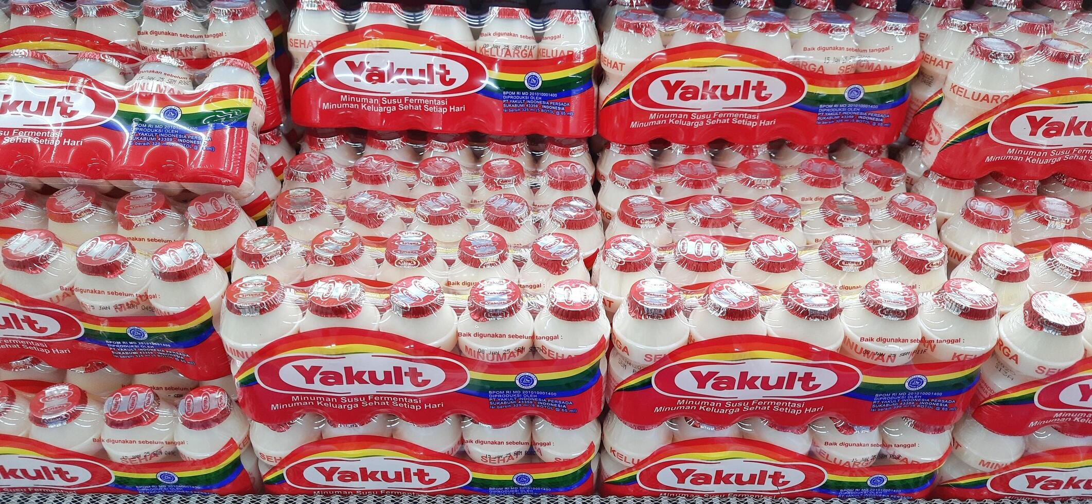 Fresh drink Yakult on display for sale at the naga swalayan supermarket. Jakarta, Indonesia - December 24 2024 photo