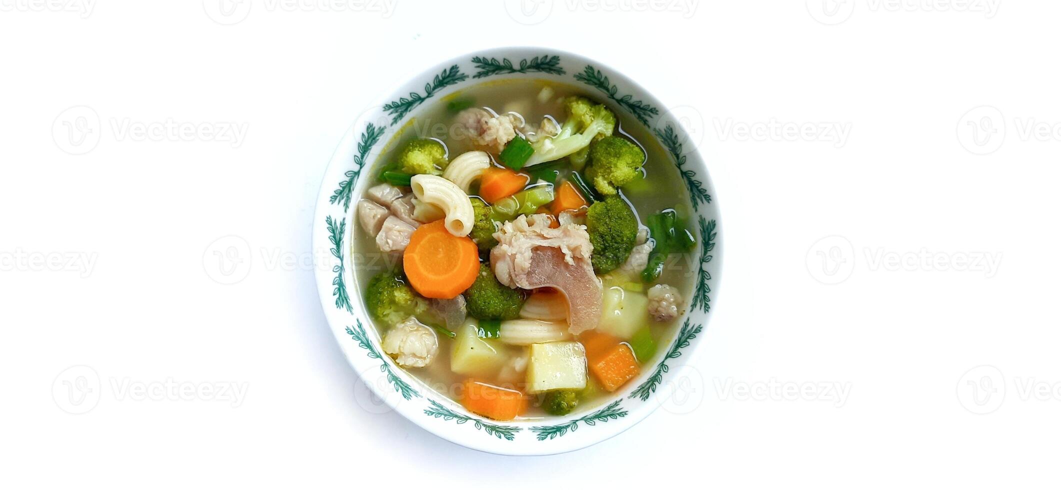 Sayur sop or vegetable with meat soup on the plate. Indonesian popular culinary. Healthy food and delicious photo