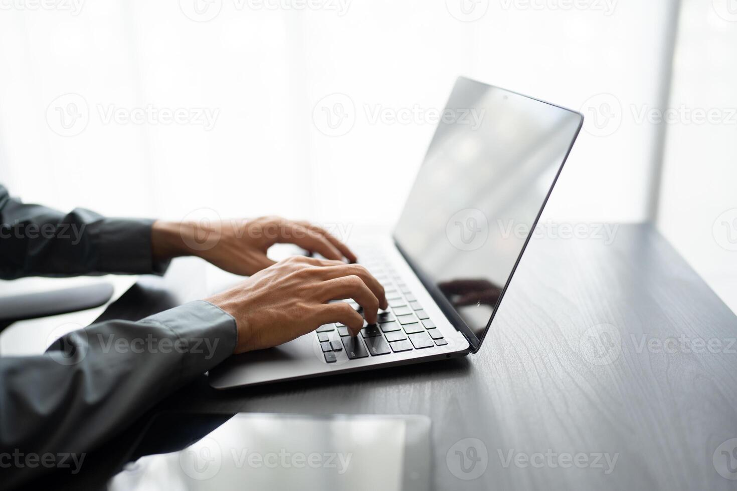 Business man working with laptop Hands typing keyboard. Professional investor working new start up project. business planning in office. Technology business.. photo