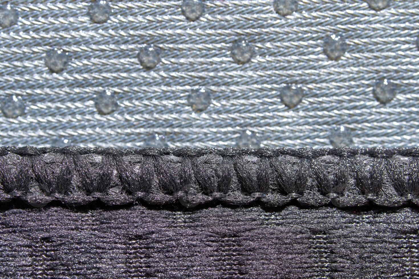 Close up of textured grey fabric with intricate patterns and raised dots. photo