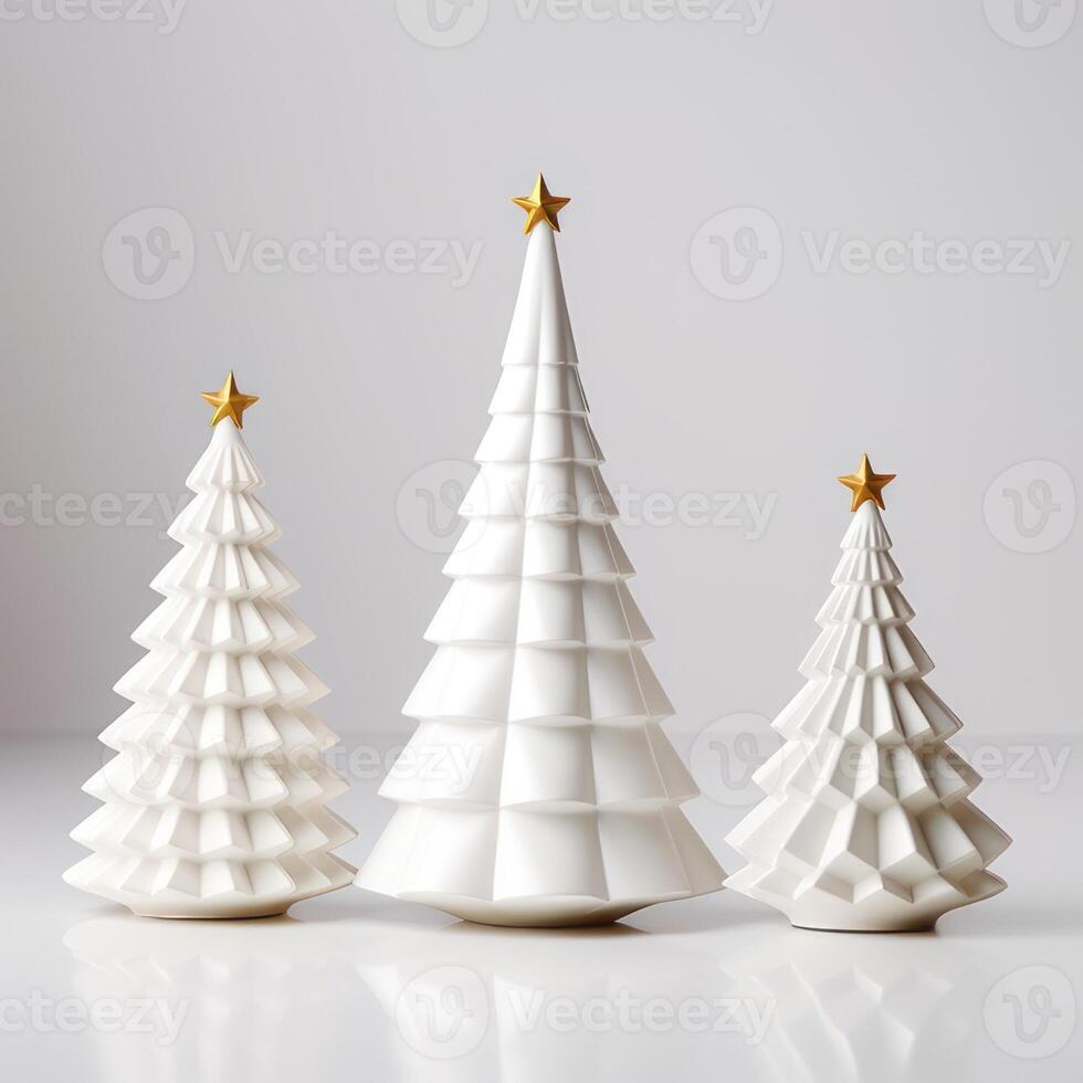 three Christmas white porcelain fir trees with a gold star on the top of their heads of different sizes on a white background. Scandinavian style photo