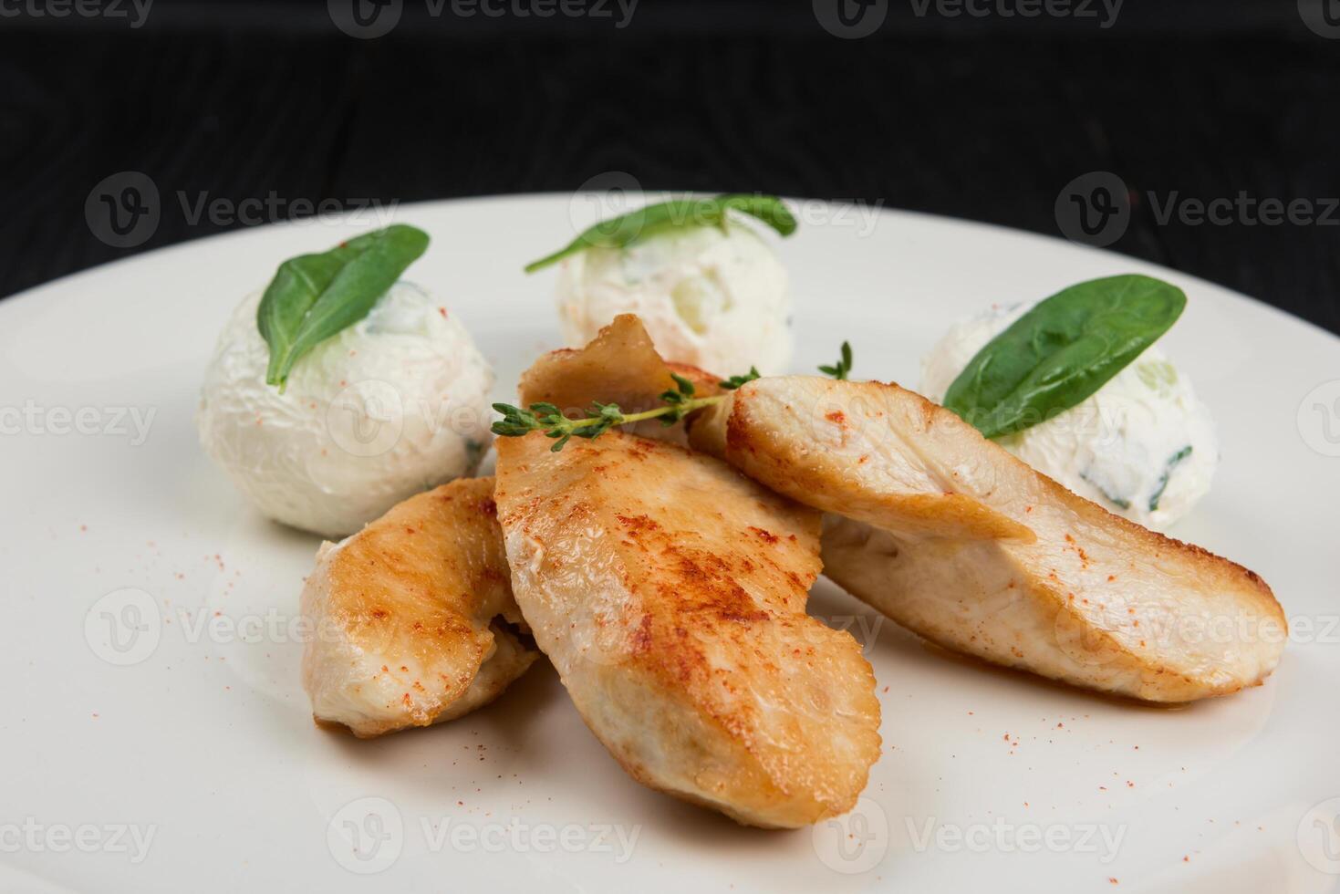 Grilled chicken breast with mozzarella cheese. photo