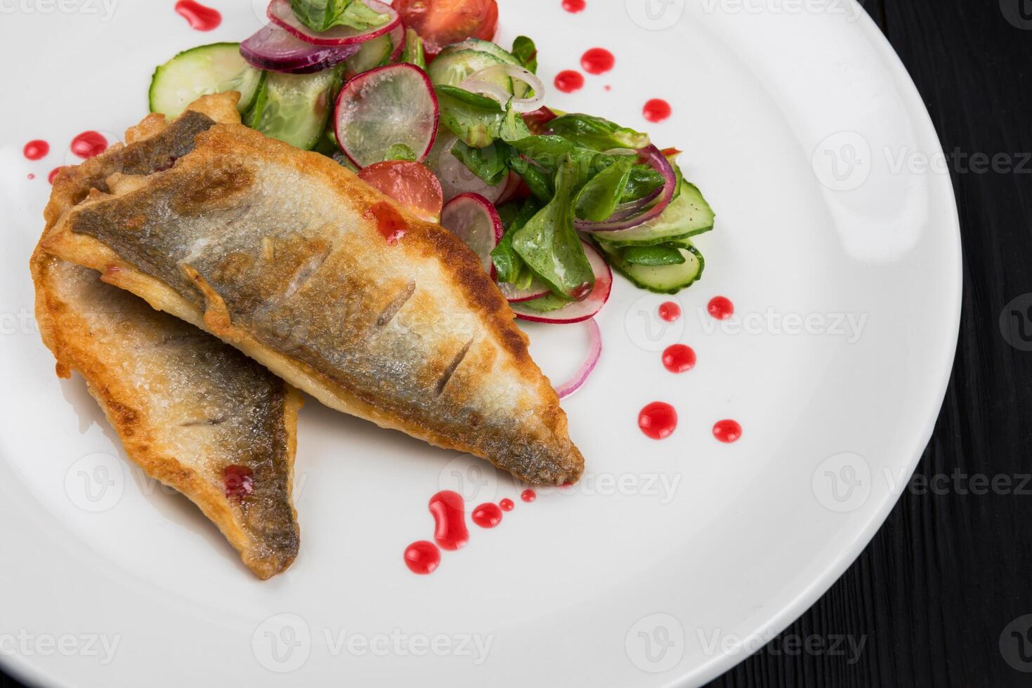 Fillet of white fish with vegetables photo
