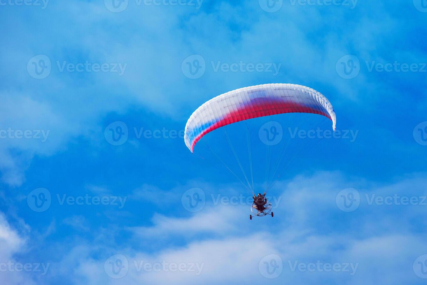 Paragliding in mountains photo