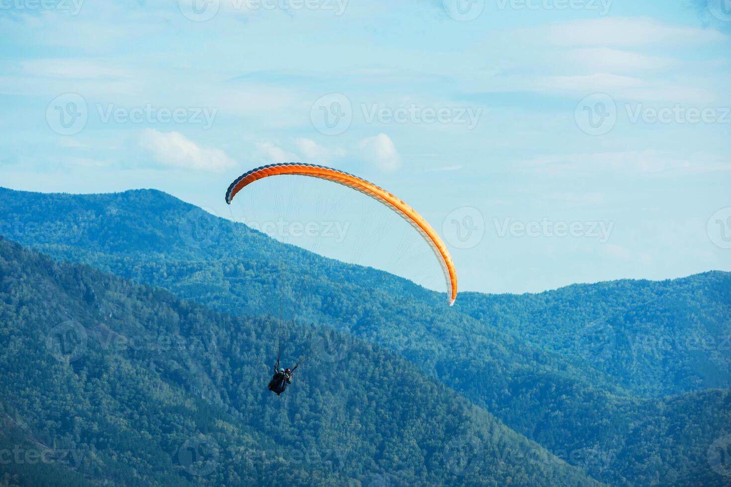Paragliding in mountains photo