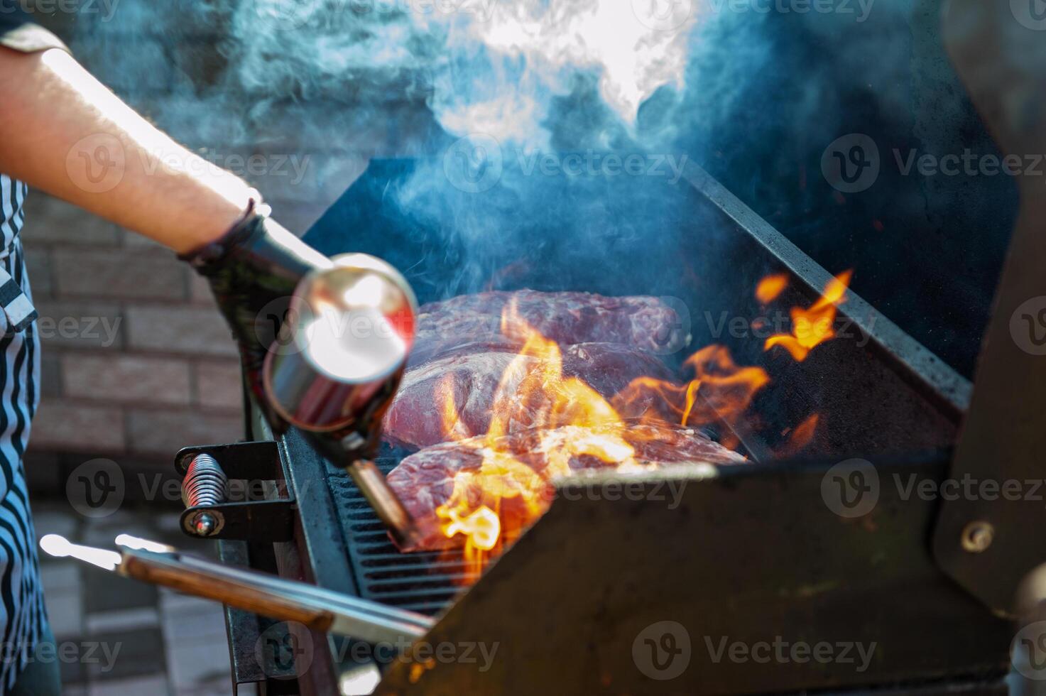 Pork meat steaks on the grill photo