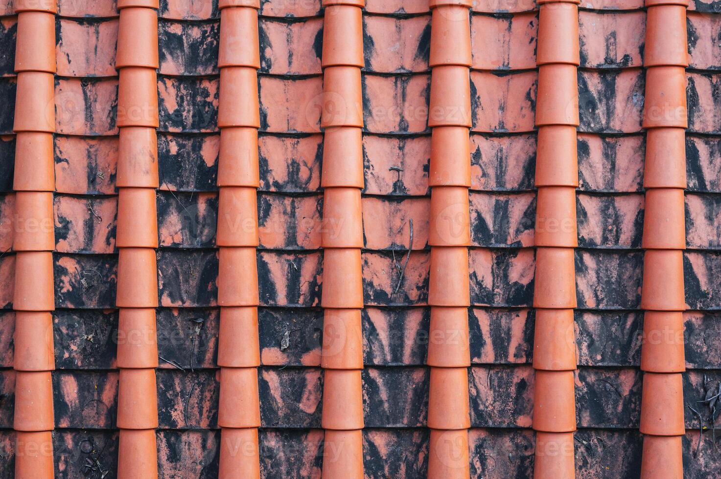 A close-up image of the traditional tile roof pattern of an old Buddhist temple. Texture for the background photo