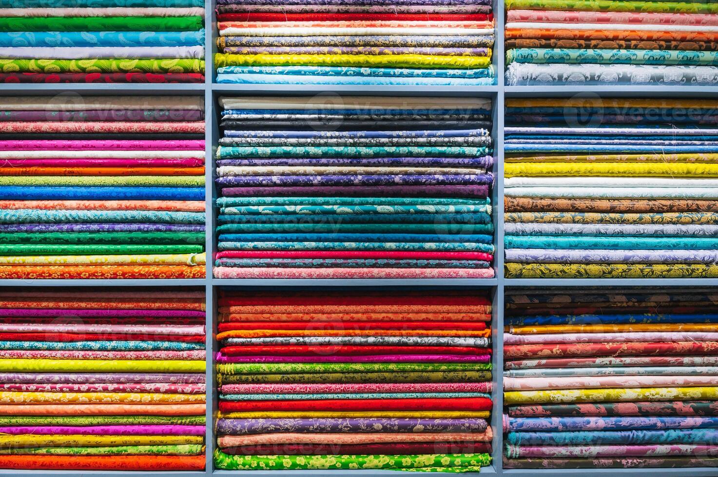 a folded bright and colorful fabric colors in the display of a retail store or atelier photo