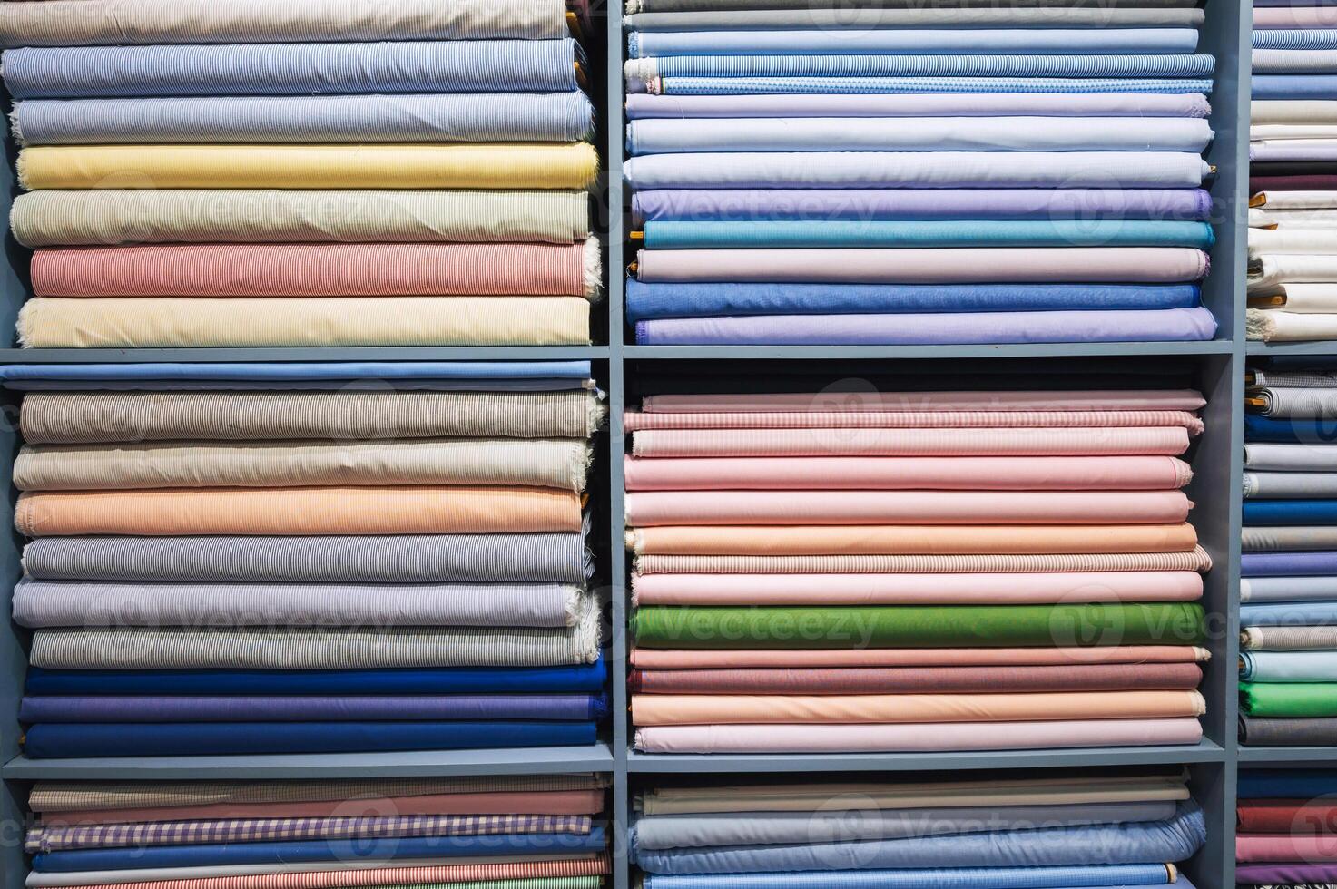 Colorful linen fabric rolls in store photo