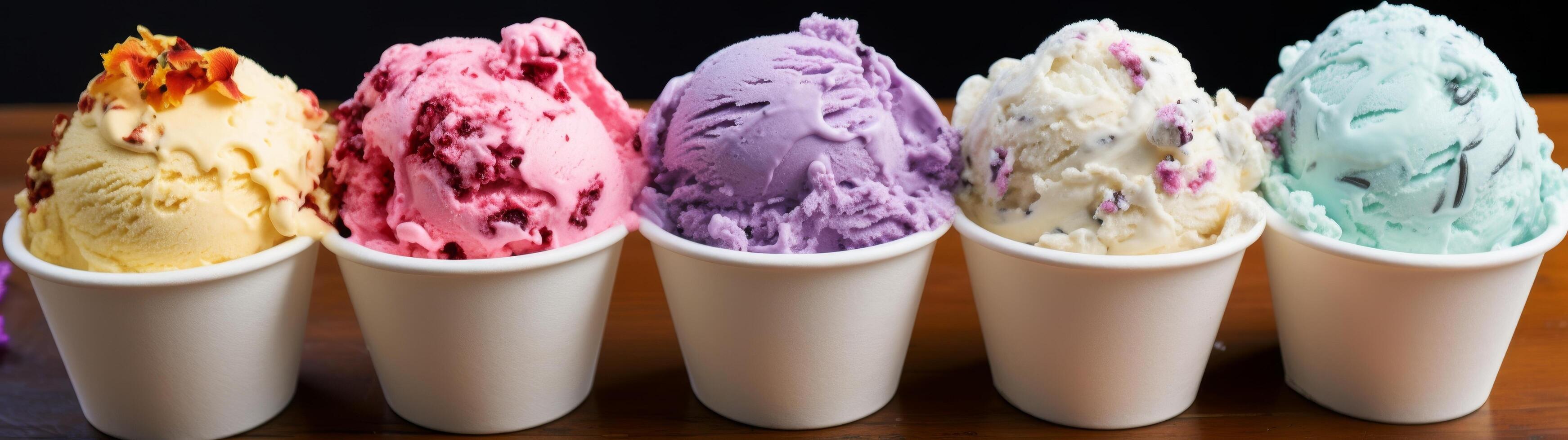 Assortment of colorful ice cream scoops in cups photo