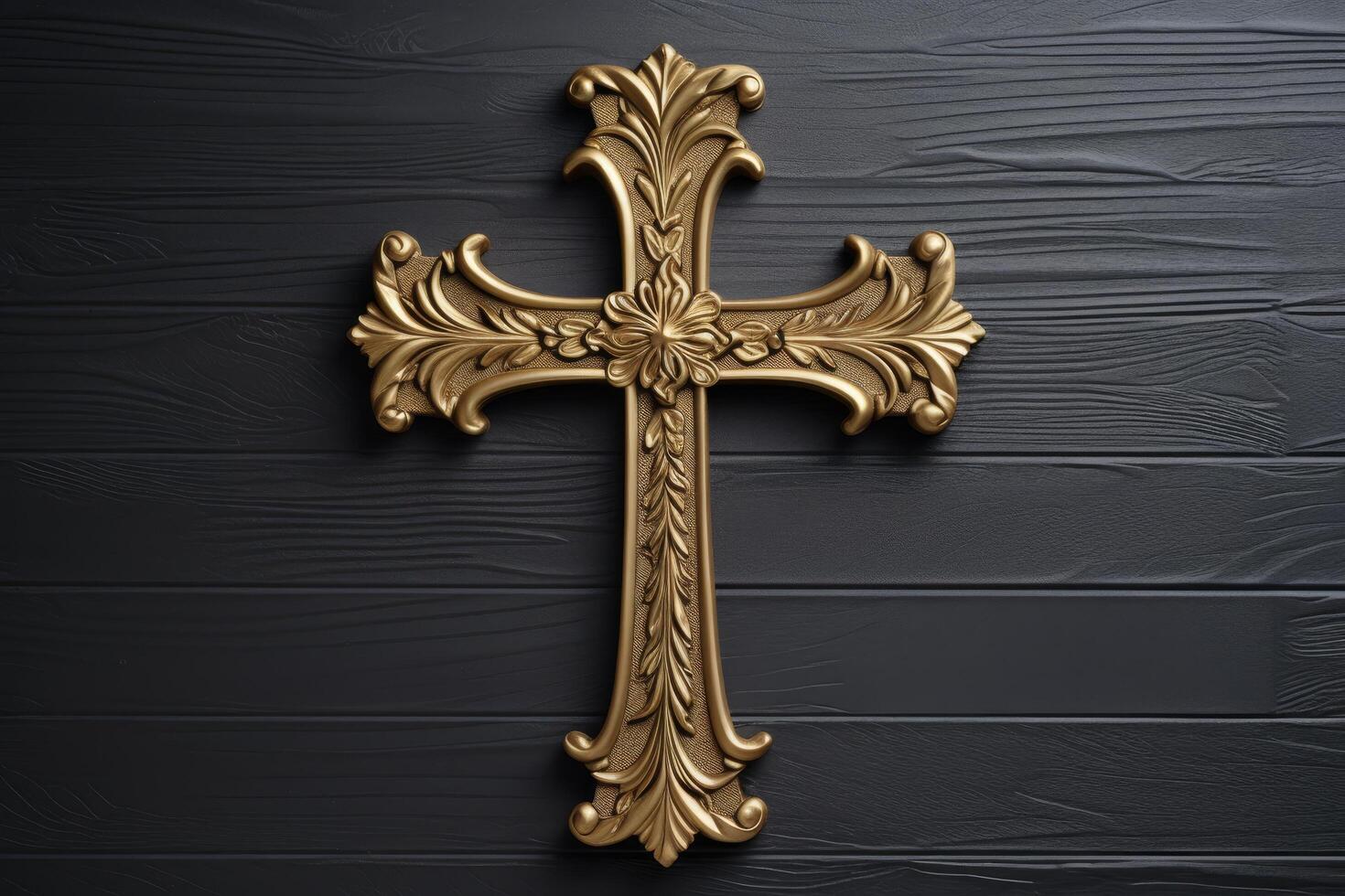 Ornate golden cross on dark wooden background photo