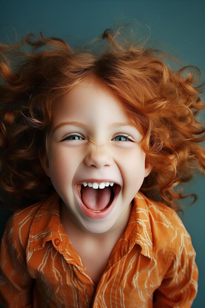 Joyful young girl with curly red hair photo