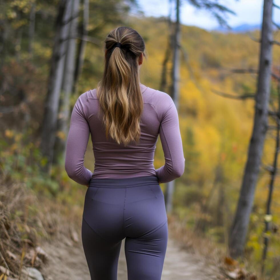 woman hiking in autumn forest photo