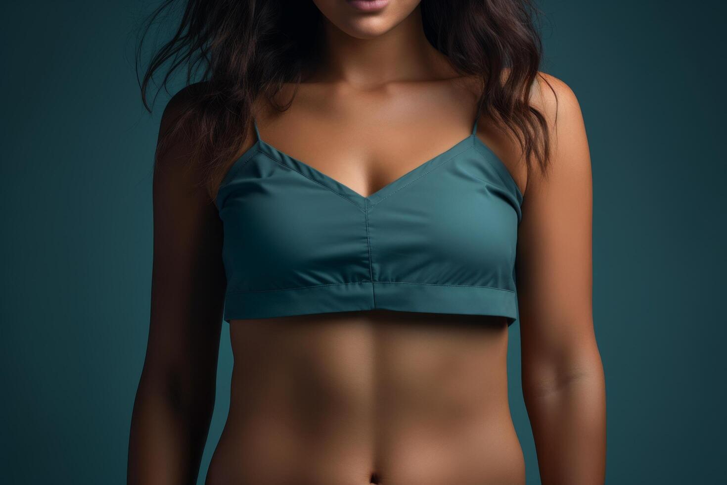 Confident woman in teal crop top photo