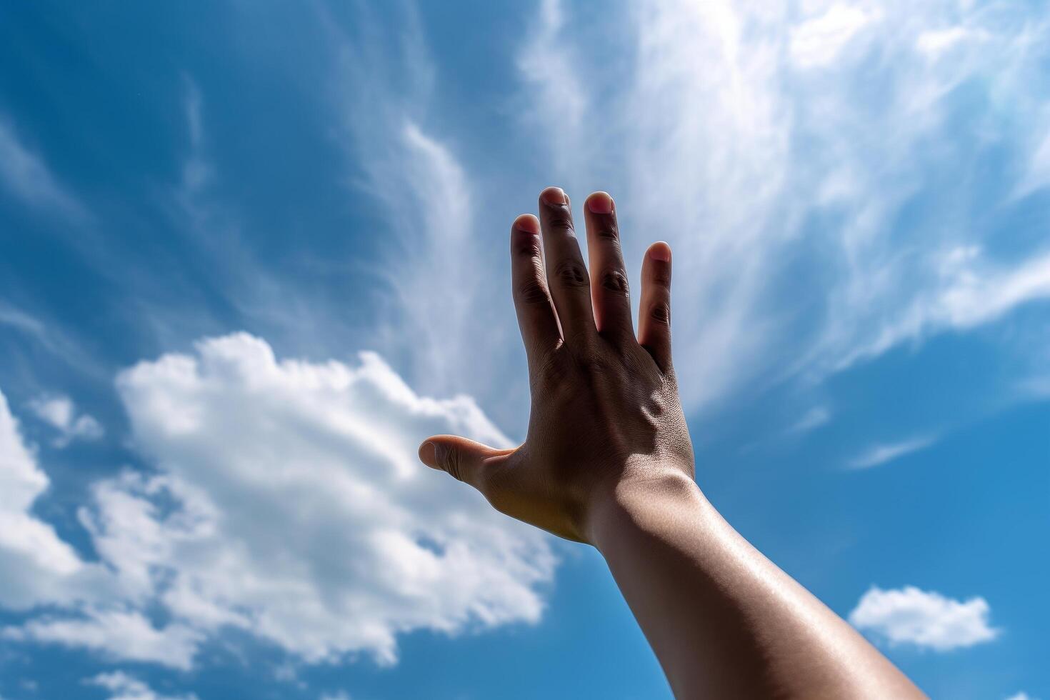 hand reaching towards the sky photo