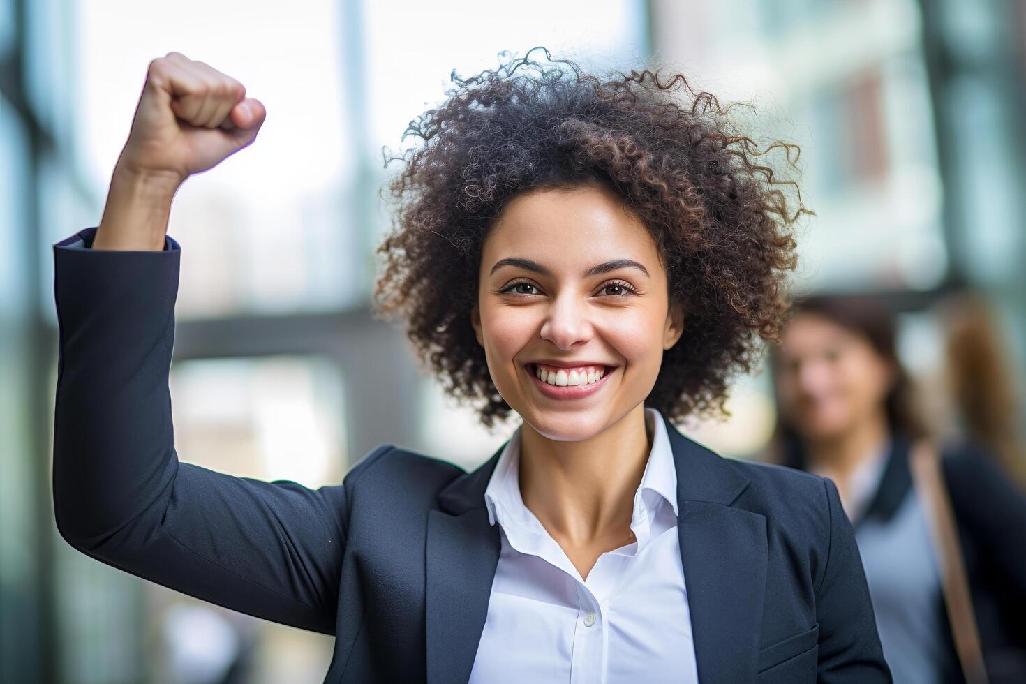 Confident and successful businesswoman celebrating achievement photo
