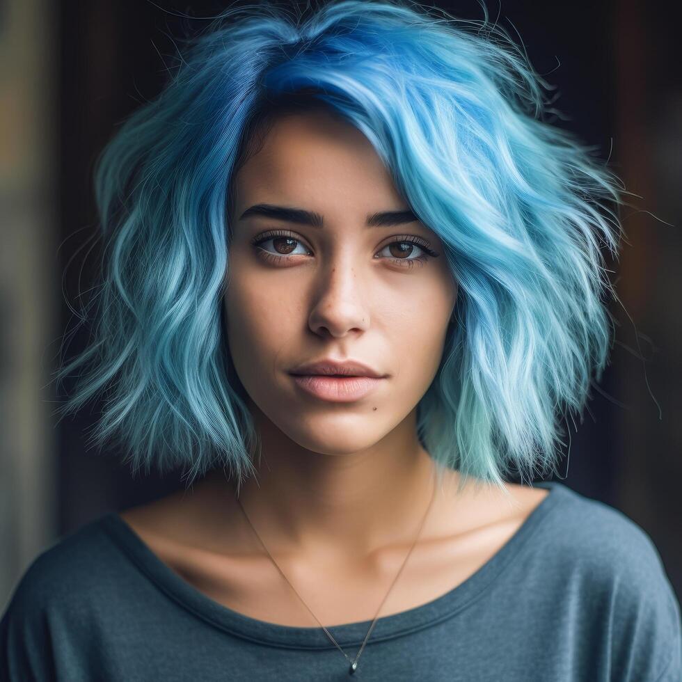 Vibrant blue haired woman with intense gaze photo