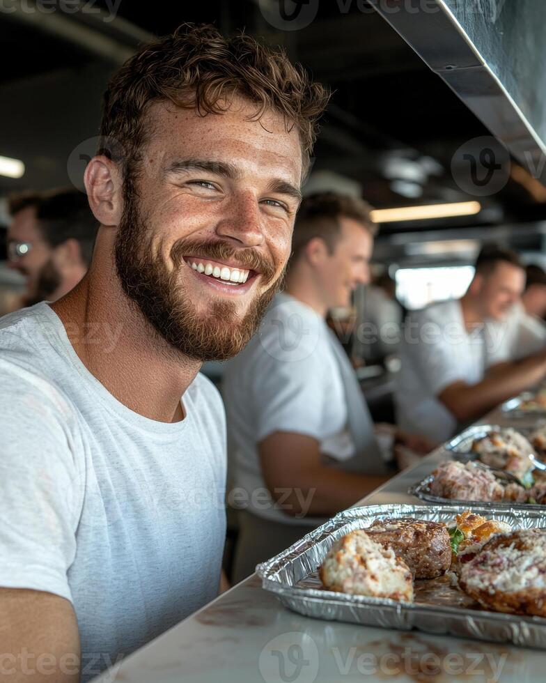 Happy chef smiling while serving delicious gourmet food photo