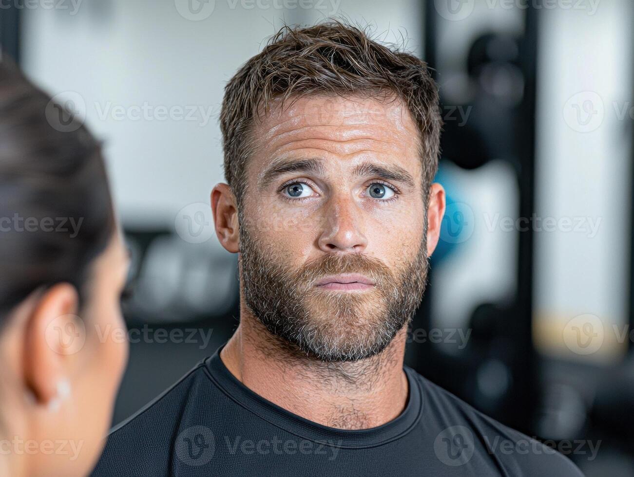 Confident man at the gym looking towards the camera photo