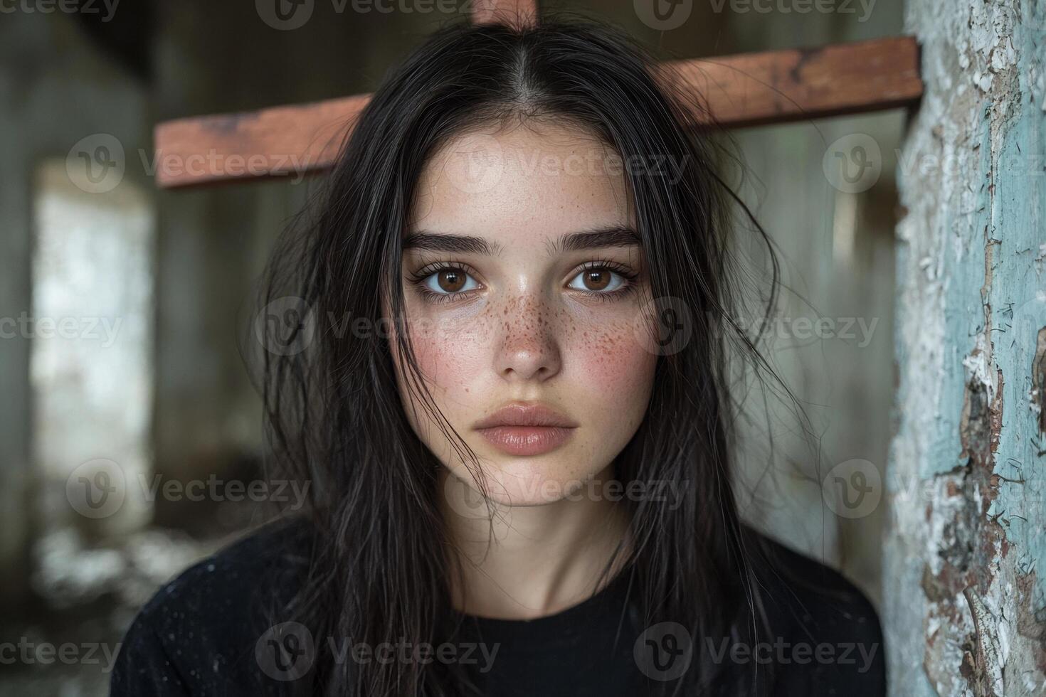 A girl with freckles and a cross on her forehead photo
