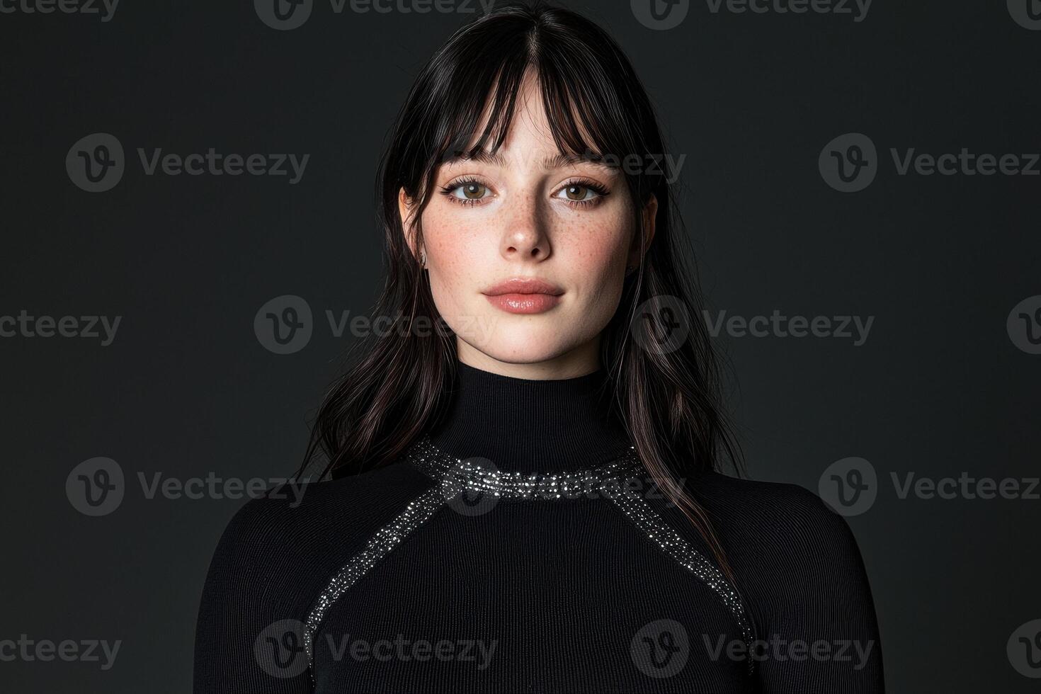 Portrait of a young woman with freckles wearing a black turtleneck sweater photo