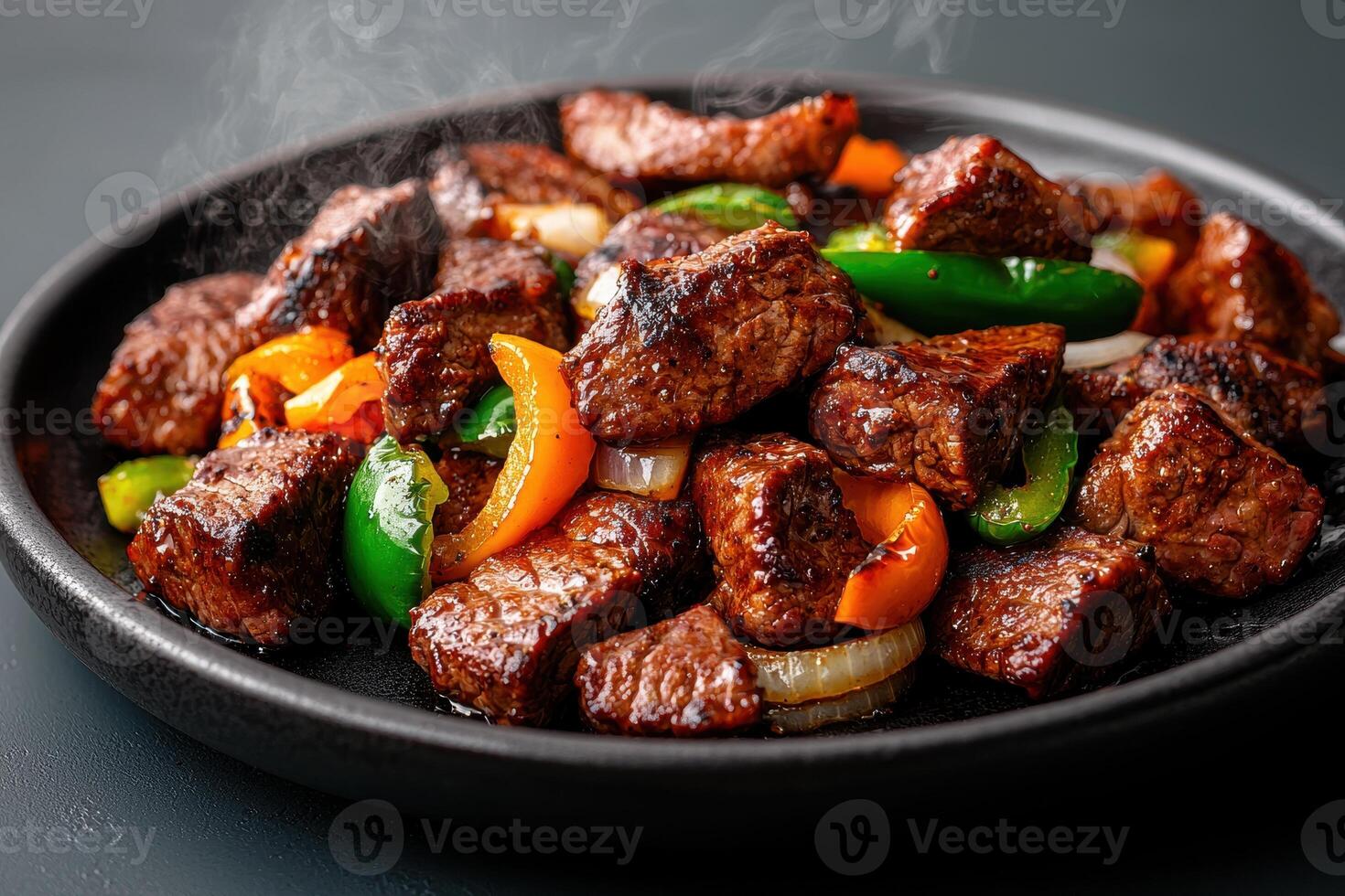 Delicious beef stir fry with bell peppers and onions photo