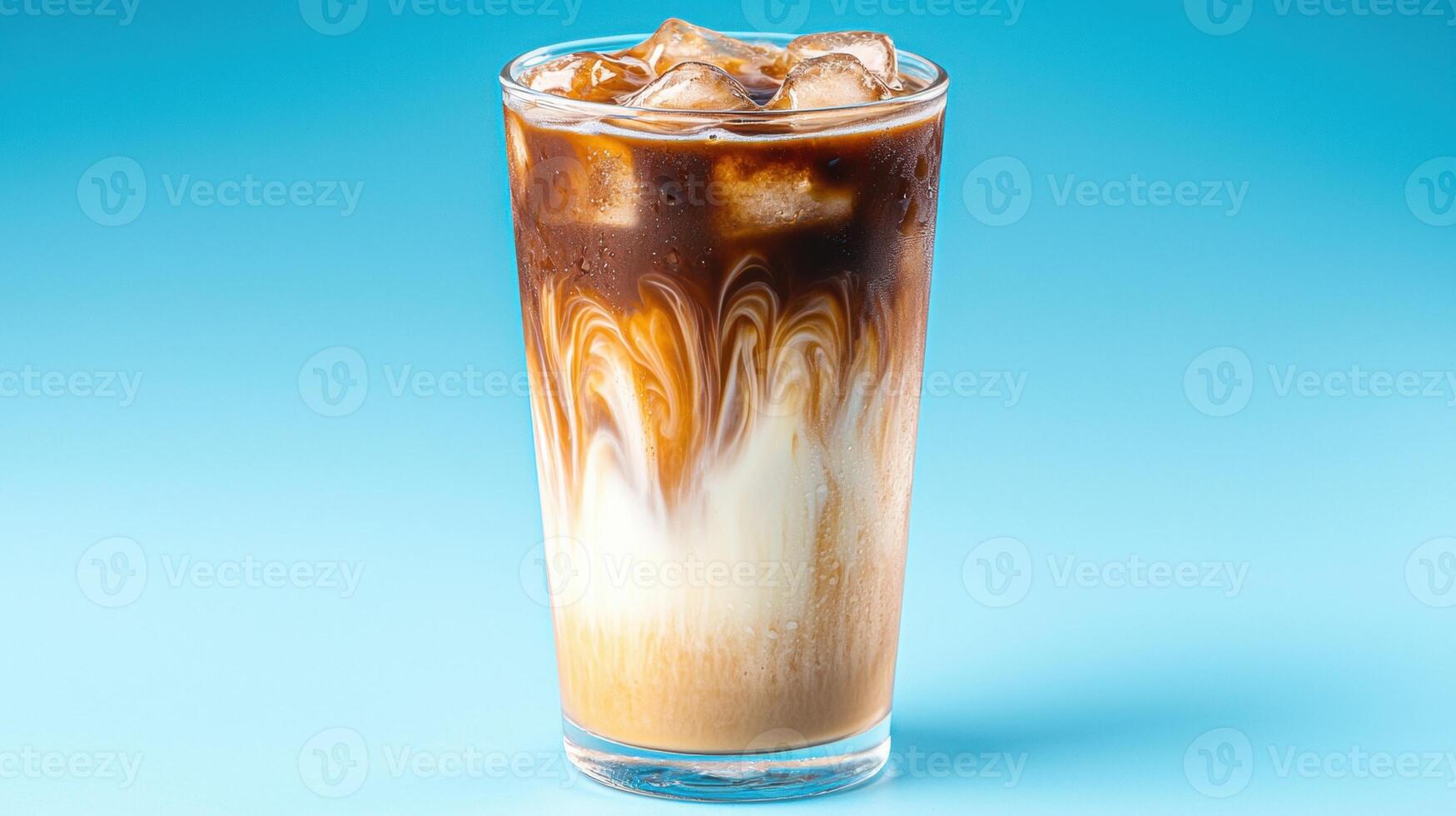 Refreshing Iced Latte with Swirled Cream and Ice Cubes photo