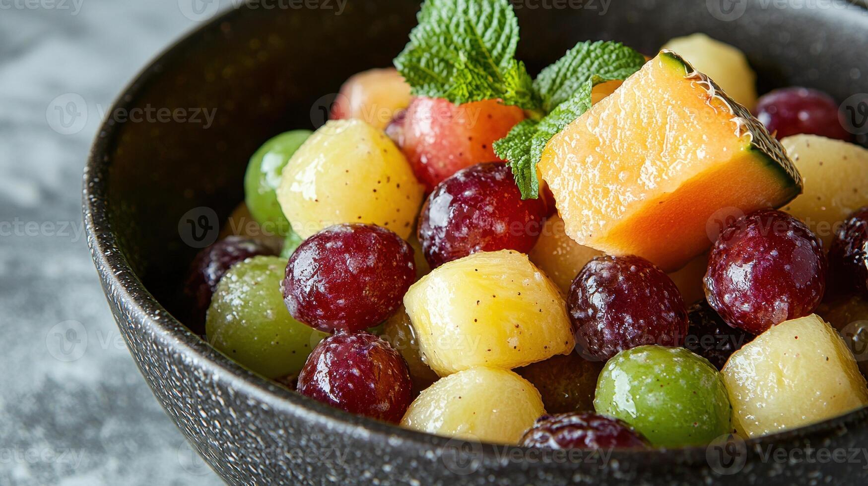 Refreshing fruit salad with melon and grapes in a rustic bowl photo