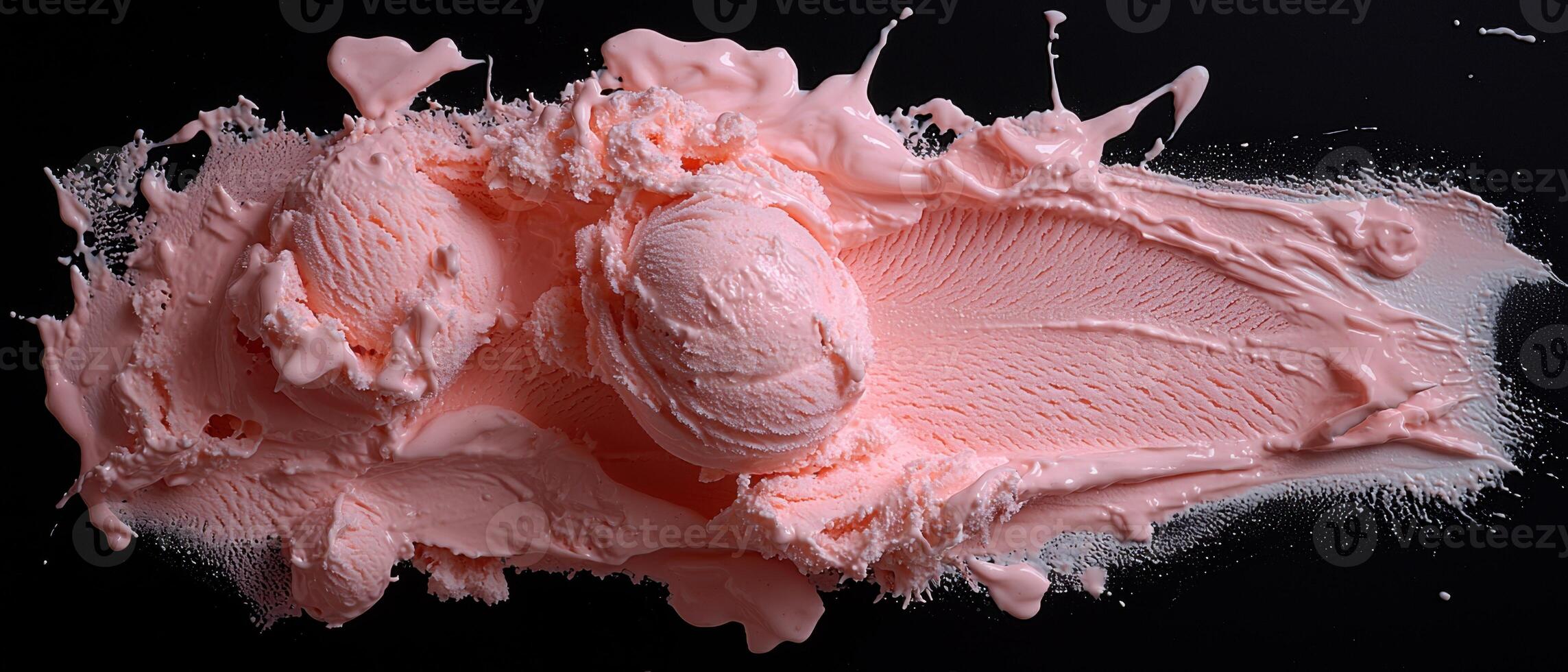 Pink ice cream explosion on black background photo