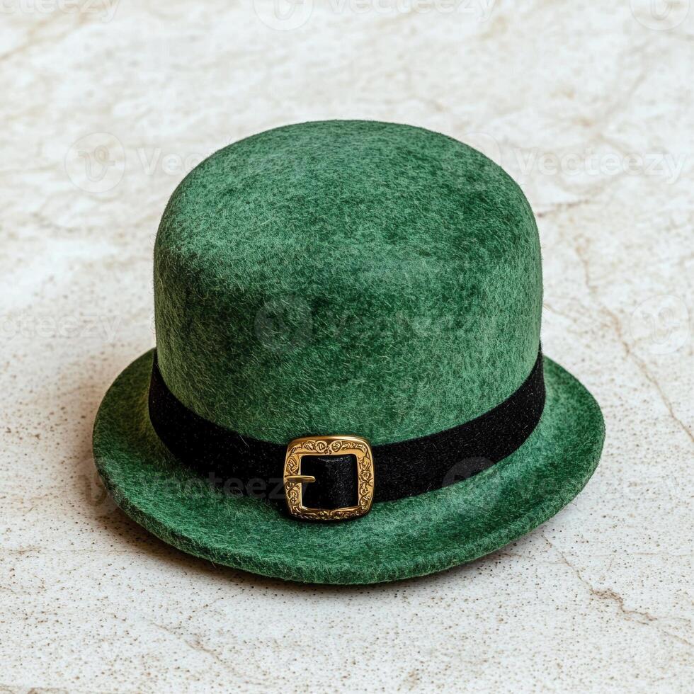 Green leprechaun hat with gold buckle on marble background photo