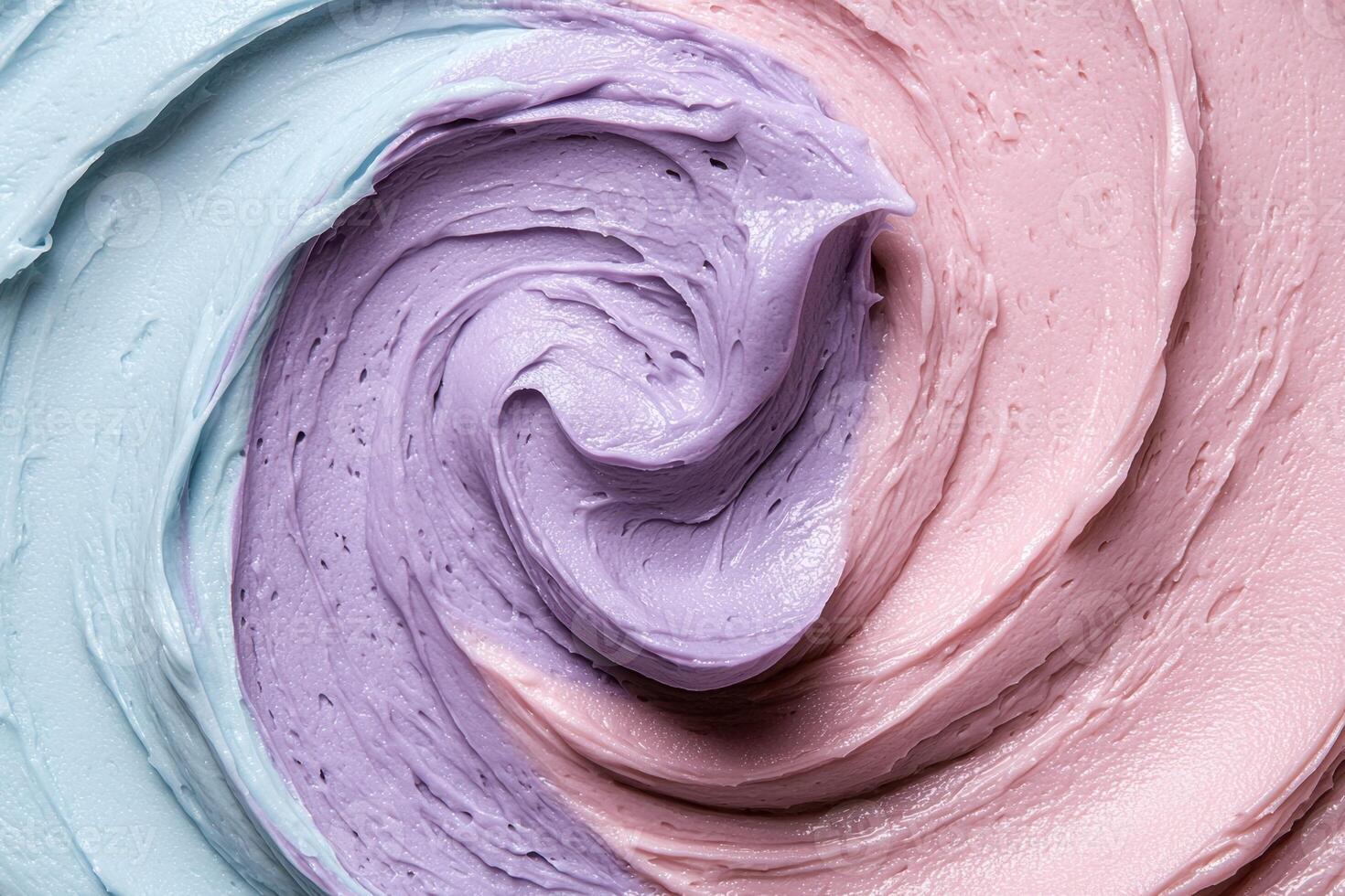 A swirl of blue and pink frosting photo