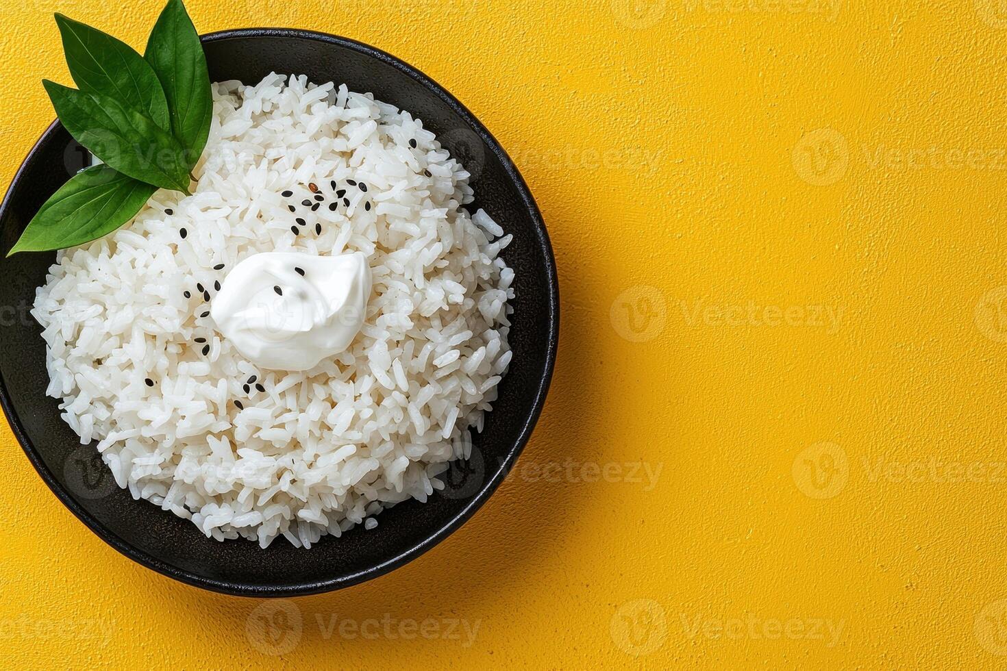 Delicious bowl of fluffy white rice topped with creamy yogurt and black sesame seeds photo